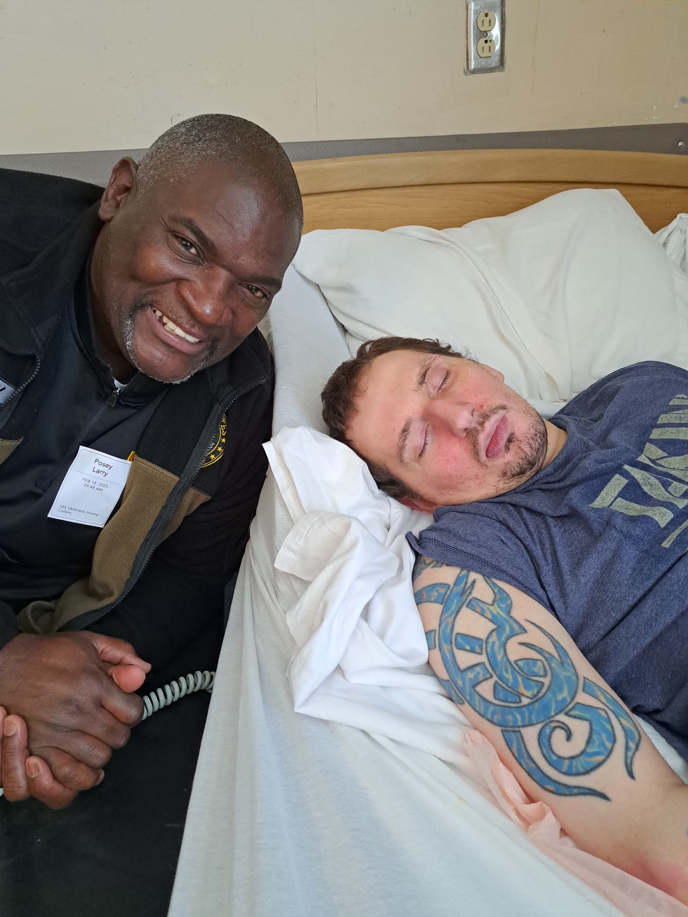 Larry Posey visiting a veteran